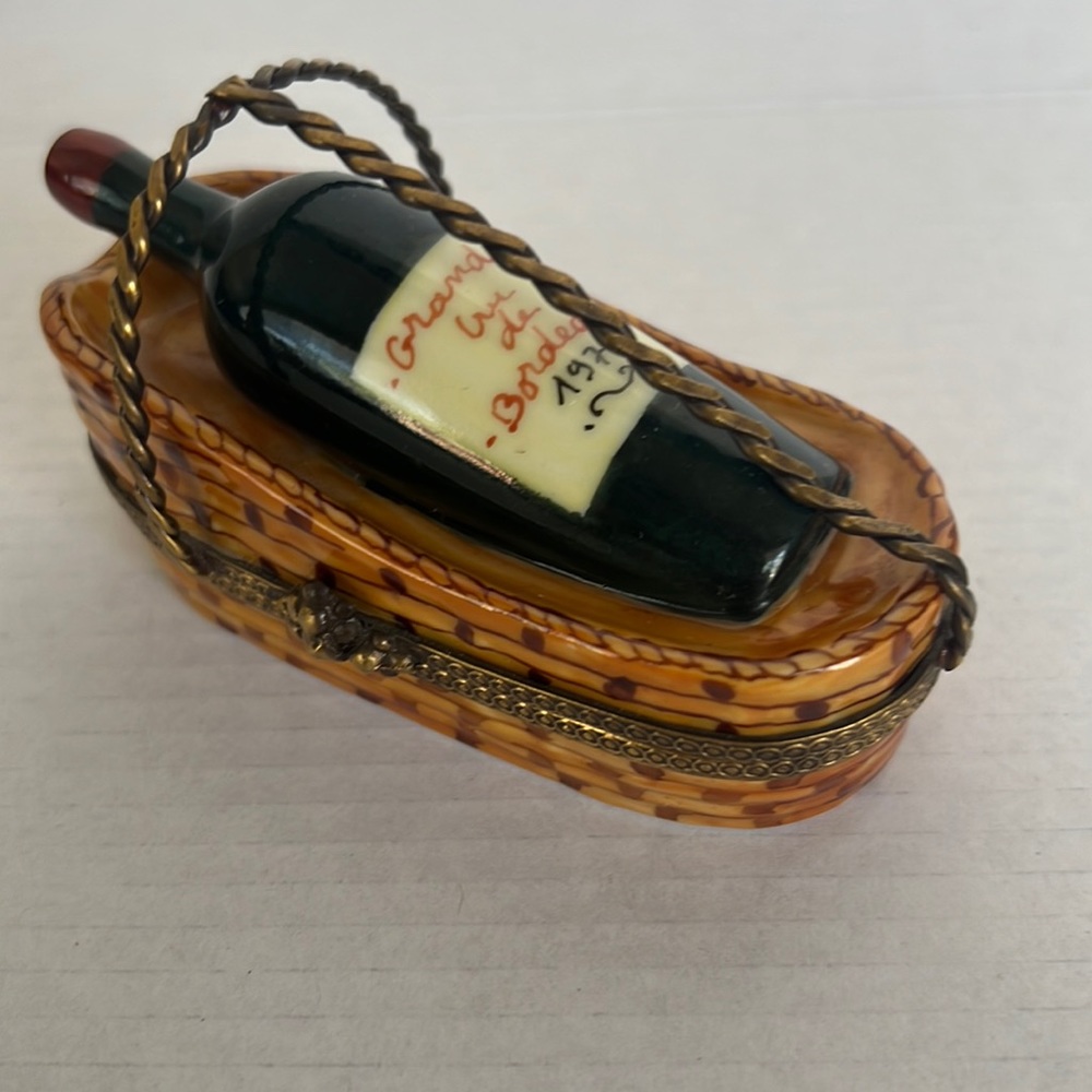 LIMOGES BORDEAUX BOTTLE IN BASKET